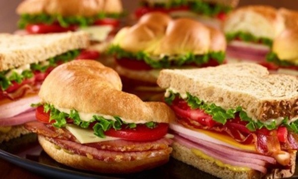 Sandwiches, Ham Dinner, or Catering Party Platters at Honeybaked Ham (Up to 50% Off). Three Options Available.