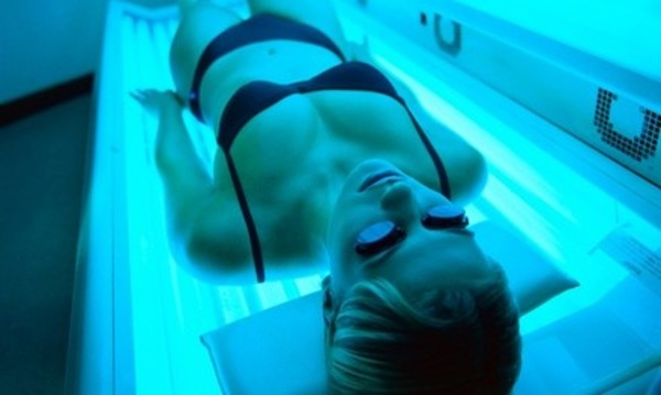 Three Tanning Sessions or One Month of Unlimited Tanning at Charlie's East Coast Hair Designs (Up to 50% Off)