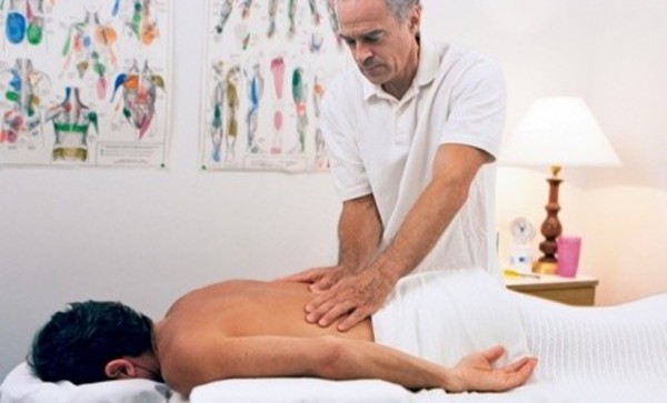 Massage and Pain Consultation or Four Chiropractic Treatments at Miracles Revealed Chiropractic (Up to 92% Off)