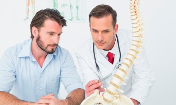 Consultation, Exam, X-Rays, and Two Chiropractic Adjustments at Discover Chiropractic (Up to 91% Off)