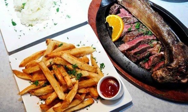 One 4-Course Prix-Fixe Dinner for Two or Four People at Talia's Steakhouse & Bar (Up to 50% Off)