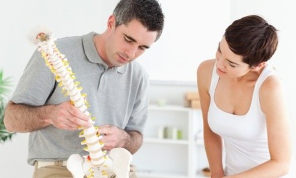 Consultation, Exam, and One, Two, or Four Adjustments at Ferraro Spine and Rehabilitation (Up to 90% Off)