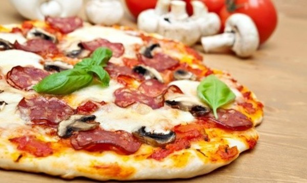 $5 for $10 Worth of Gourmet Pizza, Calzones, and Salads at Basil Doc's Pizzeria and Bistro