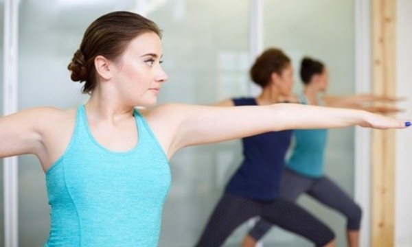 Ten or Twenty Class Pass or Two Weeks of Unlimited Yoga Classes at Eugene Yoga Downtown (Up to 72% Off)
