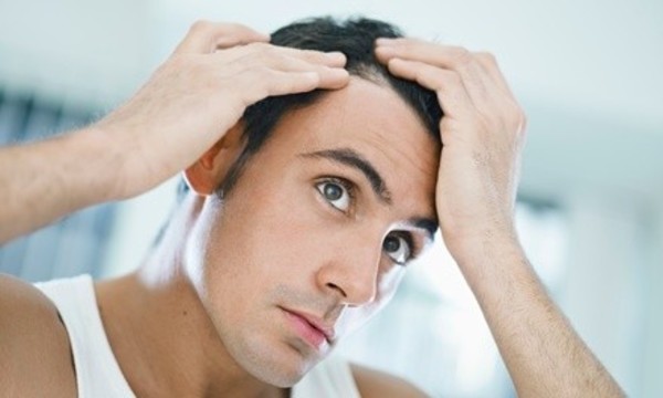 Evaluation and One or Three Months of Laser Hair-Rejuvenation Therapy at Keith's Haircenter (Up to 76% Off) 