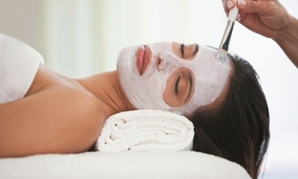 One or Two Customized Facials Plus Credit Toward Skincare Products at Aria Salon & Spa (49% Off)