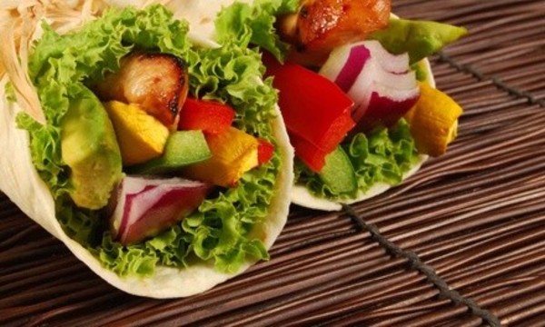 $12 for Two vouchers, Each Good for $10 Value for Dinner at Fuel Your Body Cafe ($20 Total Value)