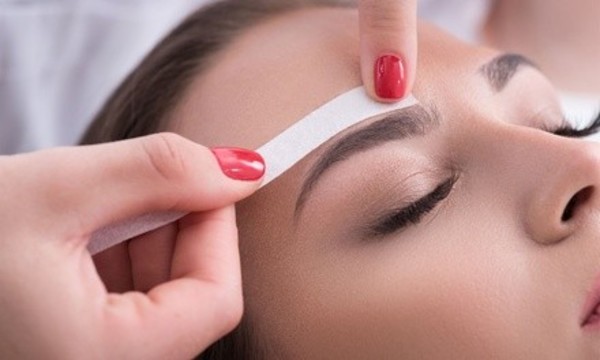 Eyebrow Wax with Optional Shape and Tint at SugaKiss Skin Care (Up to 57% Off)