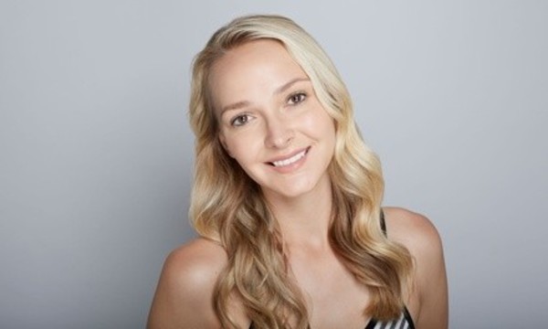 One Blowout with Optional Haircut at Hair Designs by Flora (Up to 61% Off)
