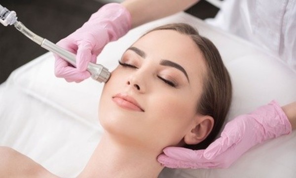 One or Two Spa Facials with Microdermabrasion and LED Light Therapy at Lotus Healing Skin Care (Up to 64% Off)