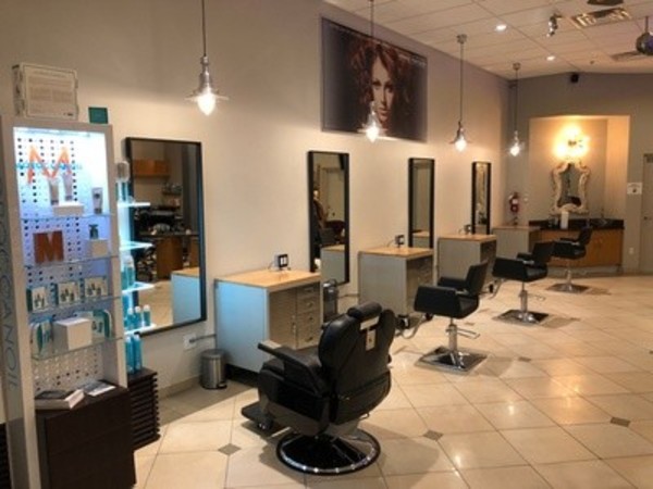 MM Haircut with Moroccan Oil Shampoo at The Mirror Mirror Salon (Up to 69% Off). Three Options Available.