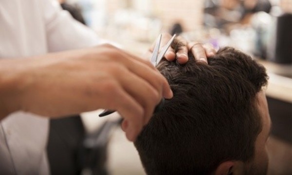 One or Three Men's Specialty Haircuts and Shampoos at Manhattans Salon and Spa (Up to 58% Off)