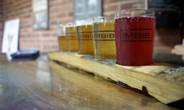 Beer Flights with Pint Glasses for Two or Four at Imbib Custom Brews (Up to 28% Off)