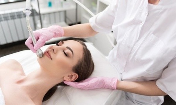 One or Two Spa Facials with Microdermabrasion and Hand Treatments at Lotus Healing Skin Care (up to 53% Off)