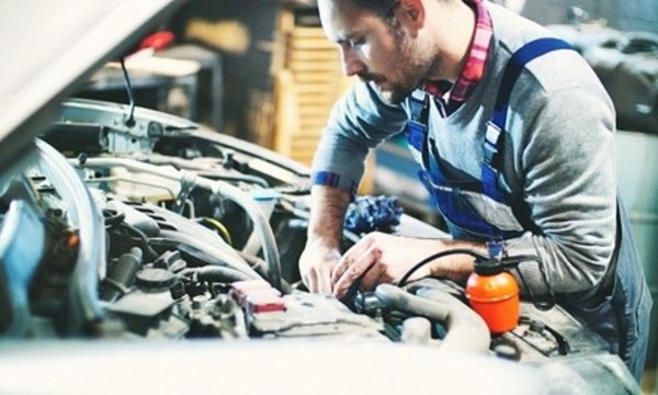 Conventional, Semi-Synthetic, or Synthetic Oil Change at Quick Auto & Exhaust (Up to 62% Off)