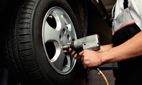 Disc Brake Pad Replacement for One Axle or Radiator Flush Winterization at JC's Lube Stop (Up to 48% Off)