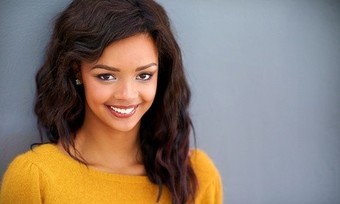 Haircut with Optional Partial or Full Highlights from Candice Bender at Carrie's Unique Salon (Up to 67% Off)