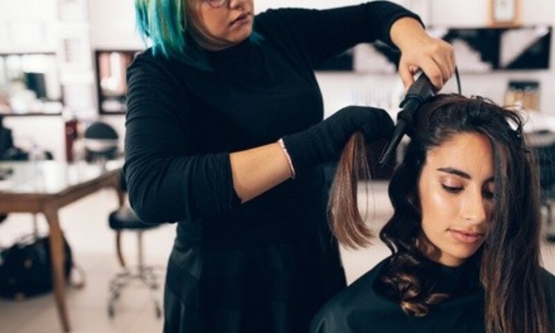 Haircut, Conditioning, Blow-Dry, Style, and Optional Root Color Touch-Up at It's So You Salon (Up to 60% Off)