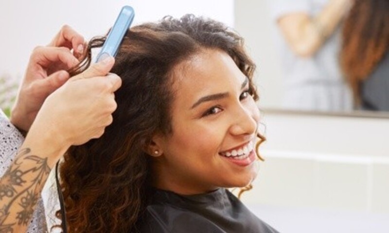Hair Style with Trim and Relaxer or Haircut and Shampoo at Paris Salon Studios (54% Off)