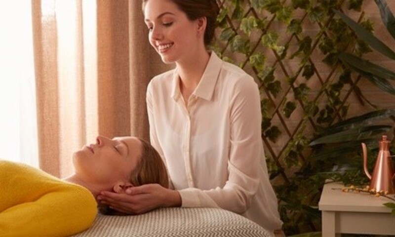 Reiki Session at A Healing Touch Holistic Massage Therapy (Up to 40% Off). Two Options.